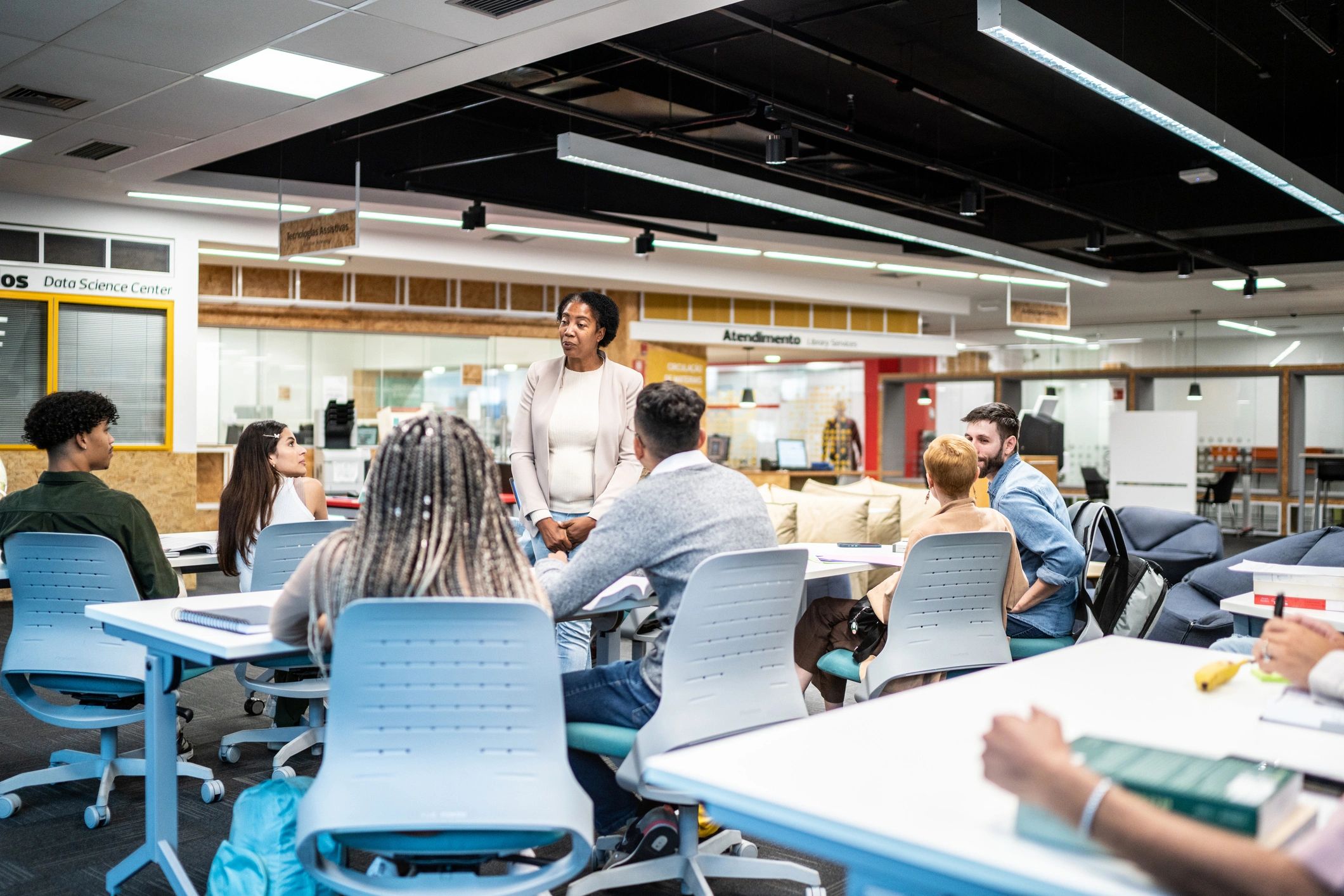 Teacher facilitating discussion with adult learners