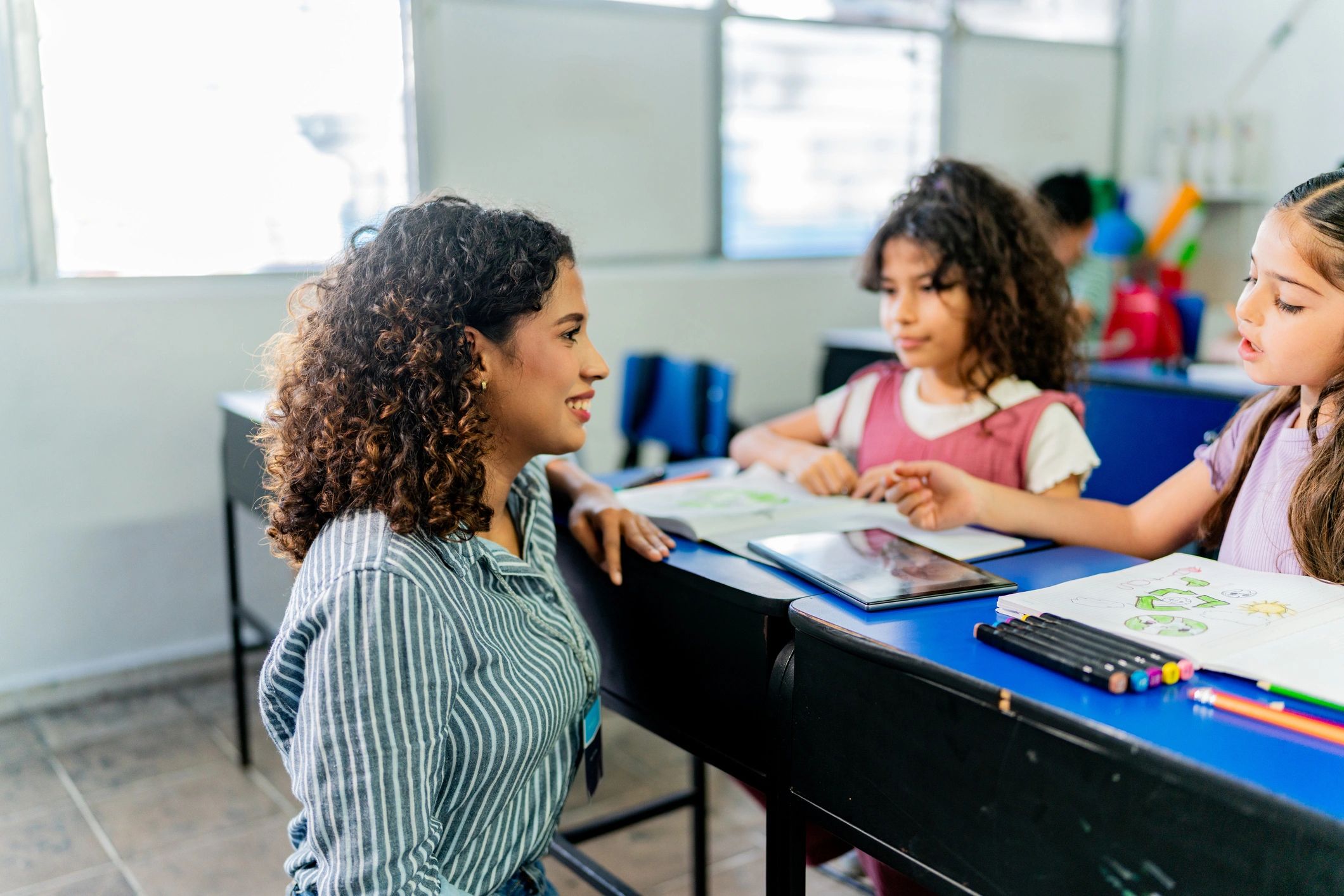 Teacher coaching a student during class