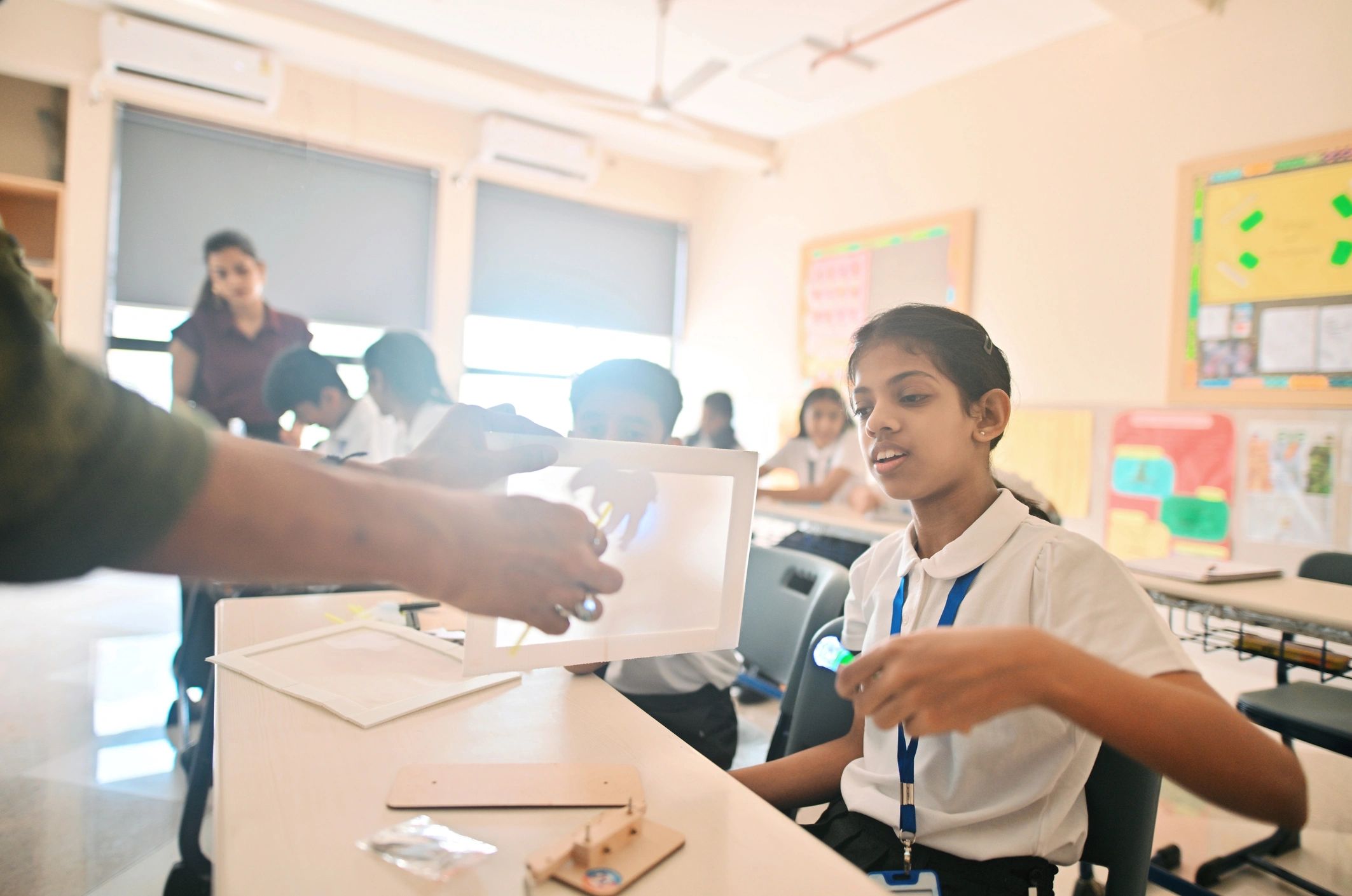 Teacher demonstrating a STEM project to students